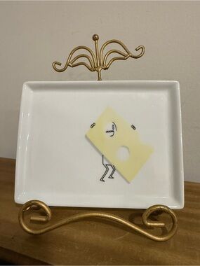 CB2 Oliver appetizer snack plate featuring a whimsical stick figure design